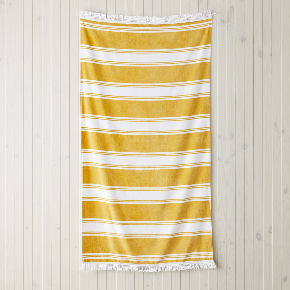 Yellow and white store striped beach towels