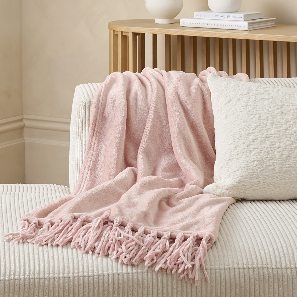 Pink tassel throw sale